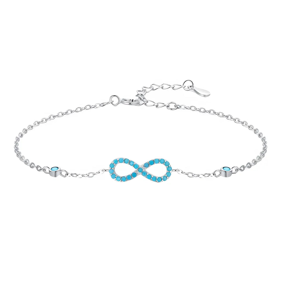 pulseira-de-prata-infinity-com-turquesa-no-fundo-branco